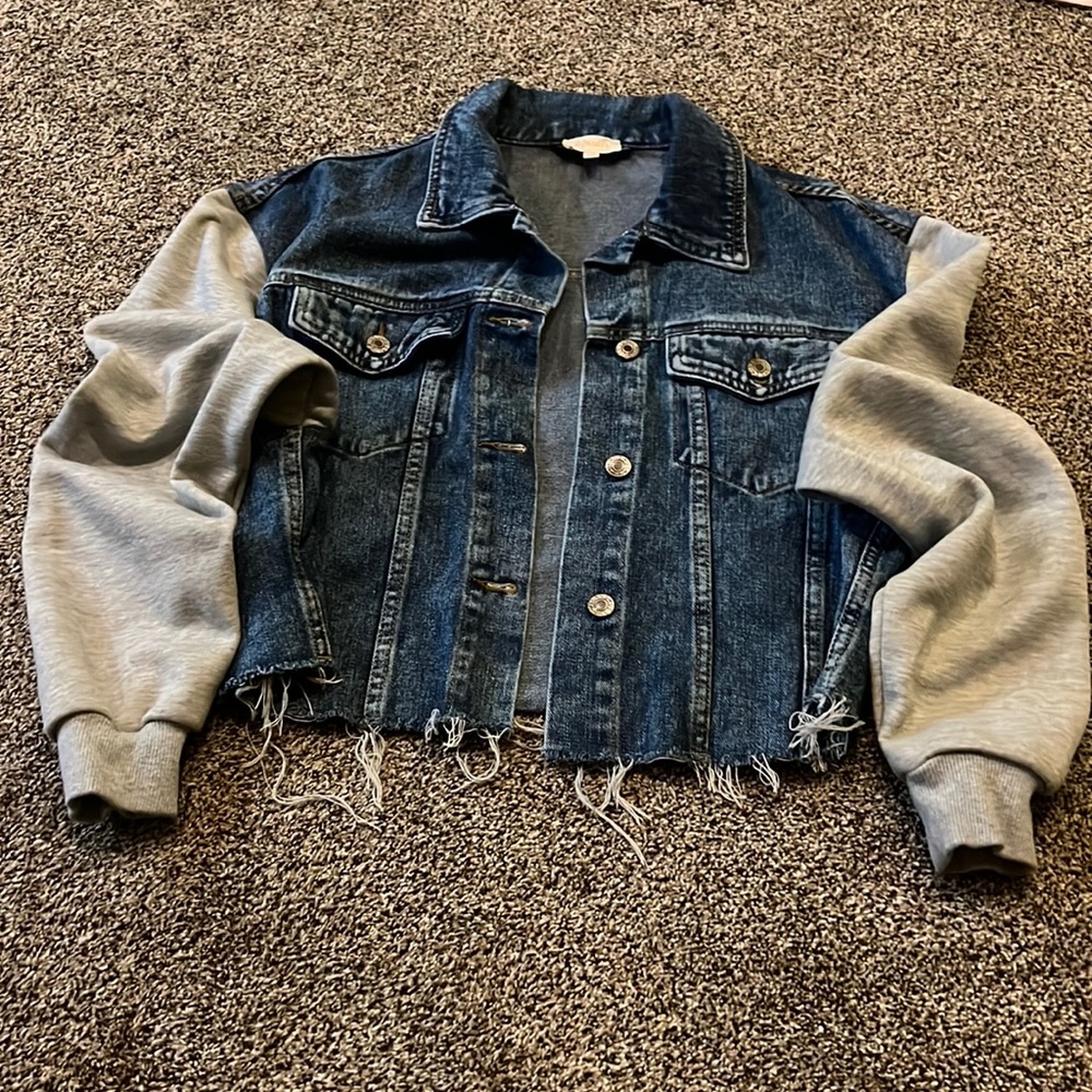 A. Peach cut off jean jacket with gray sweatshirt material sleeves size small